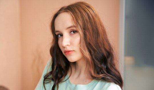 Young cutie with natural tits is seated on a dick